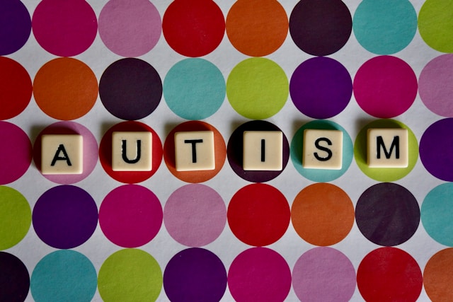 Scrabble pieces spelling autism in article about autism and extremism and harms of Prevent on autistic children
